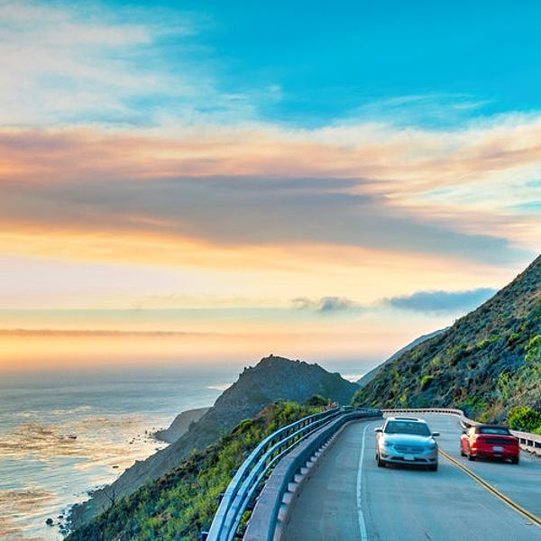 Cars drive on the Pacific Coast Highway at Big Sur in California, USA