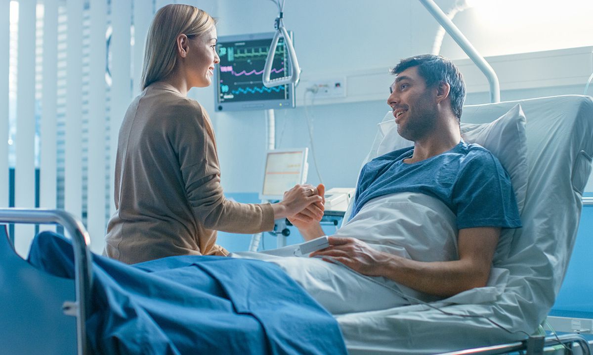 Image of a man in a hospital after a car accident, highlighting the importance of seeking medical attention immediately.