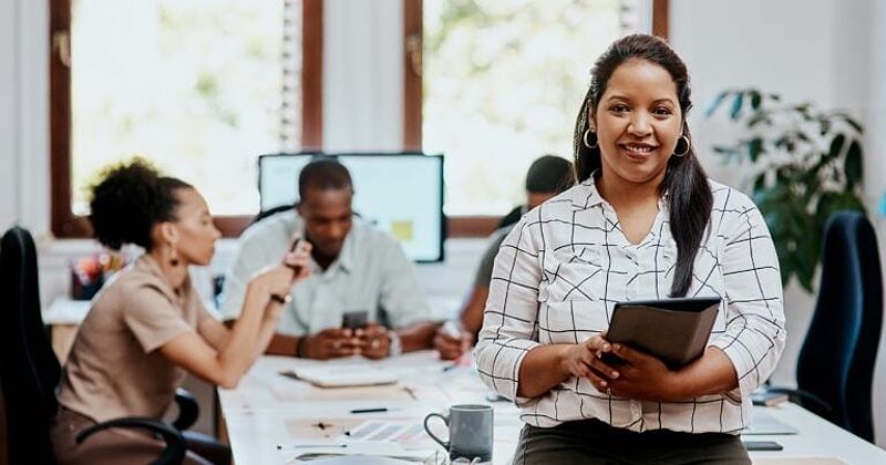 Small business owner in California on a tablet looking for the best loan for starting her business