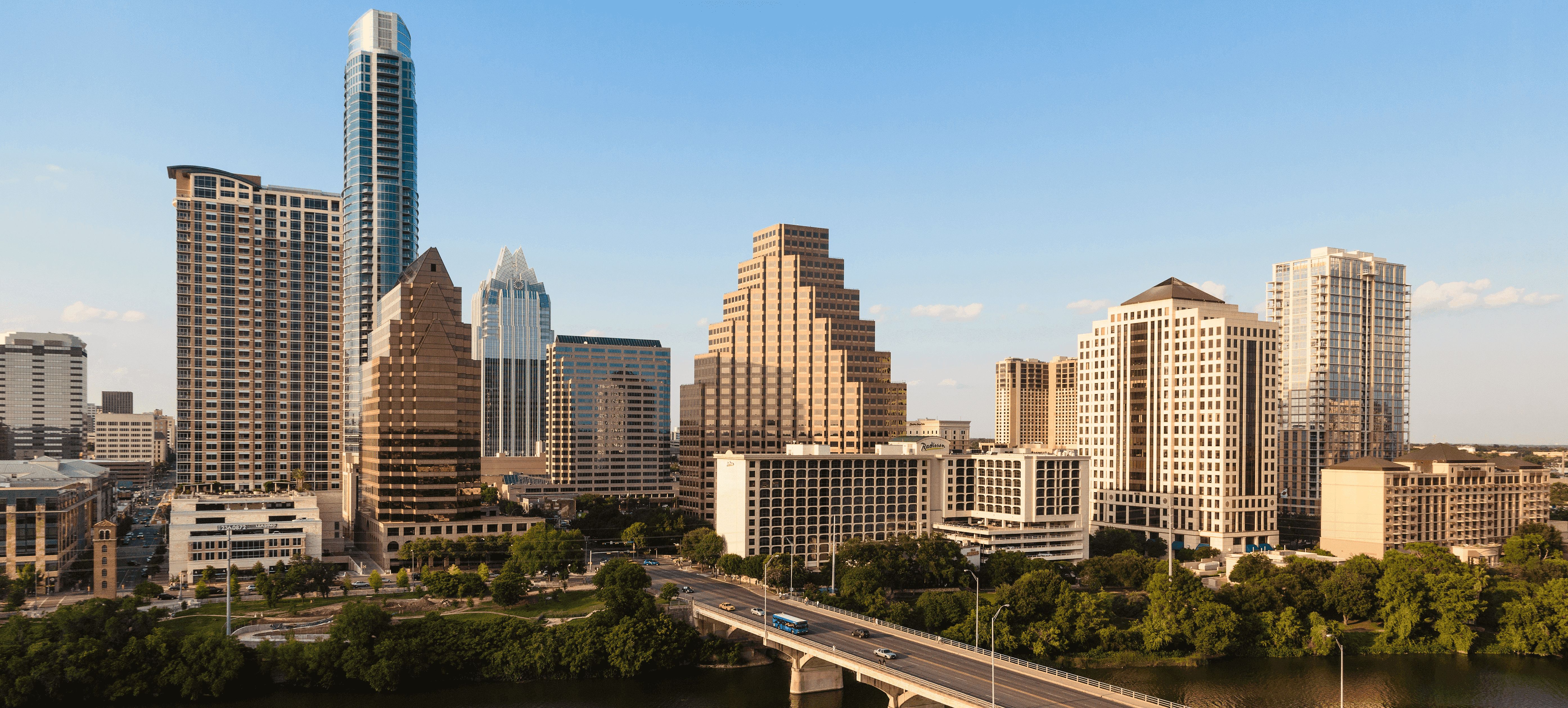 View of the city with cars driving on a highway